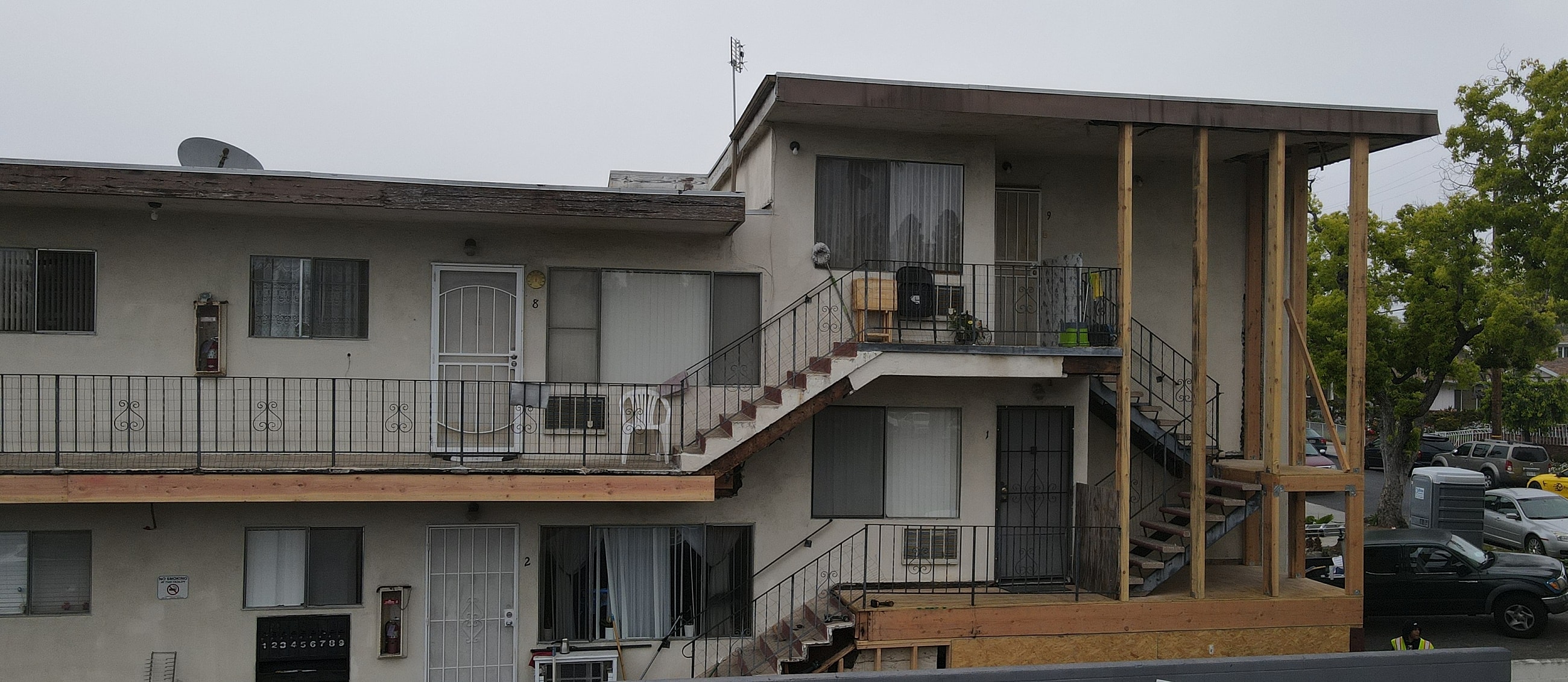 Apartment building with staircases and balconies.