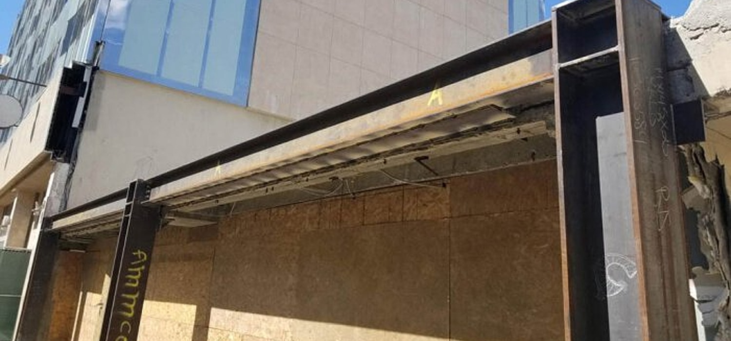 Building facade with construction elements exposed.