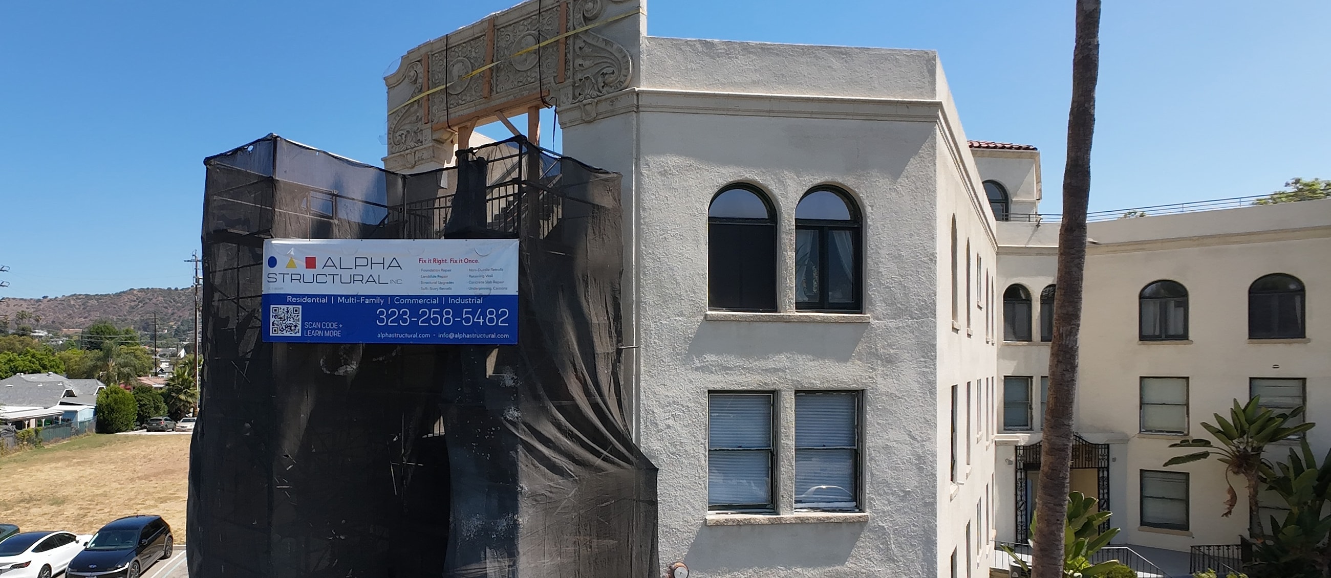 Building renovation with construction signage displayed.